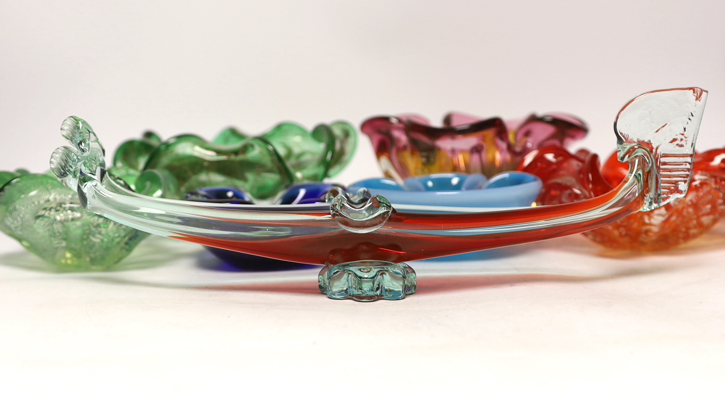 Seven Murano glass small bowls, one in the form of a long boat, 33.5cm long